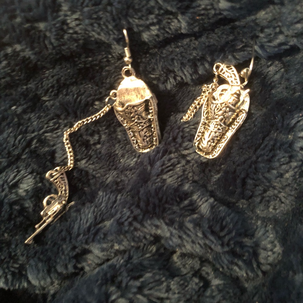 Slinging pistol gun in a holster earrings